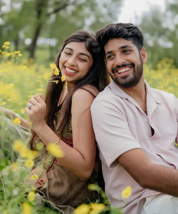 This is the kind of moment I live to capture. Pure, unscripted joy in a field of yellow flowers, a perfect memory of a carefree day together.