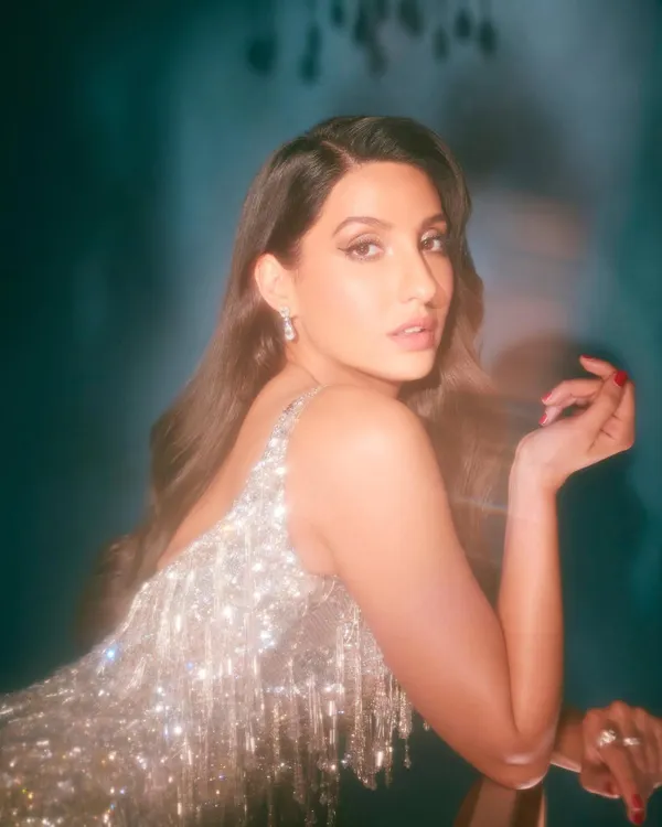 I styled Nora Fatehi in this sparkling retro tassel dress from Falguni Shane Peacock. It's a fun, glamorous party look that's all about movement and shine, perfect for a high-energy event or photoshoot.