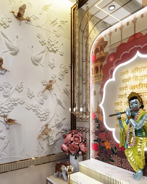 We capture the essence of spirituality in every detail. This pooja corner features a beautiful idol of Krishna set against a custom backlit panel, complemented by a stunning 3D wall mural of birds and flowers.