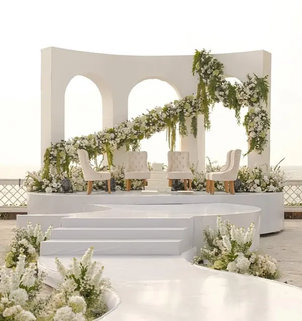 This is the dream. A modern, minimalist mandap set against the endless ocean in Goa, proving that true elegance is about simplicity and a breathtaking view. I design spaces where your vows become the centerpiece.