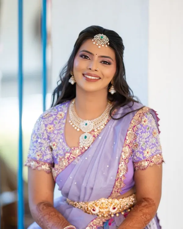 This is the moment every bride dreams of. For this special day, we created a custom lilac langa dhavani from a silk saree, complete with an intricately hand-embroidered blouse. It’s all about making you feel like the most beautiful version of yourself.