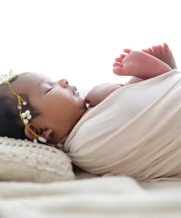 So tiny, so perfect. A simple white wrap and a soft pillow are all you need to show off the pure beauty of a newborn. This is one of my favorite classic newborn poses.