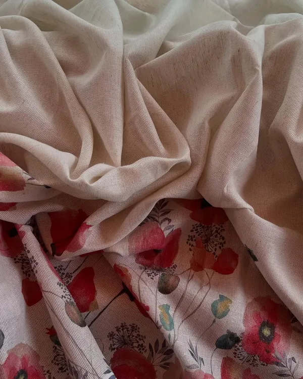 This Jute Daman printed fabric combines an earthy, natural texture with a beautiful floral print, perfect for creating unique and artistic outfits.