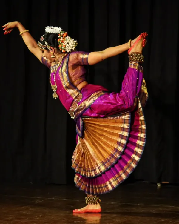 A dynamic pose from my solo performance, "MOHAM". This posture requires balance, strength, and grace, capturing the technical precision that is the foundation of Bharatanatyam.