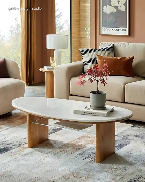 This elegant coffee table is a perfect example of mixed materials. We combined a luxurious marble top with warm wooden legs and a practical glass shelf, resulting in a centerpiece that is both beautiful and functional for a modern living room.