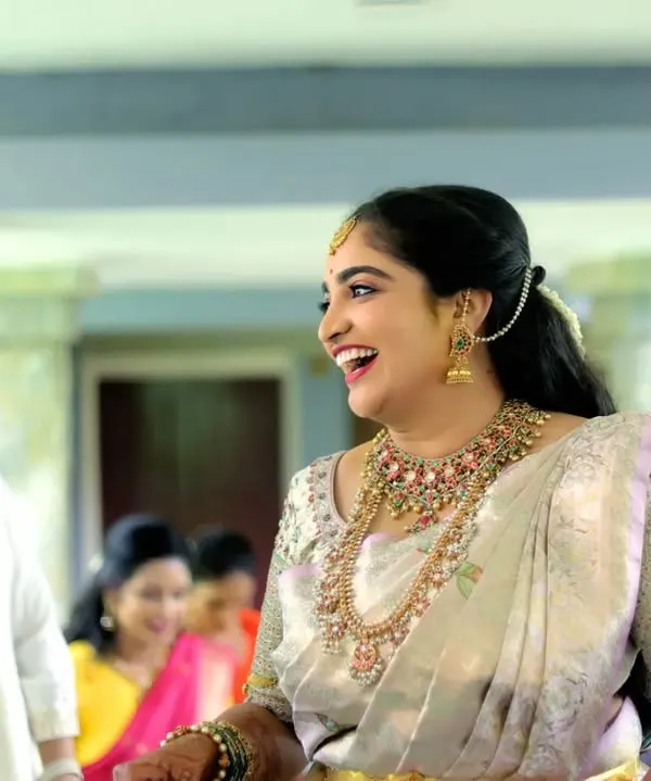A moment of pure, spontaneous laughter from the bride. These are the candid shots we live for, capturing the real emotions and joy of the day.