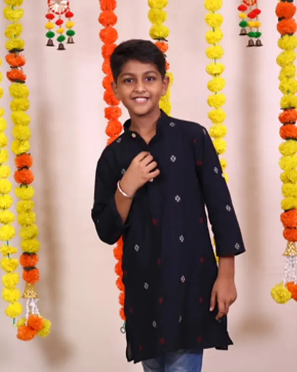 There's something so special about a boy in a kurta. This dark, handloom cotton kurta with subtle motifs is a classic piece that looks smart and feels comfortable, making him the center of attention.
