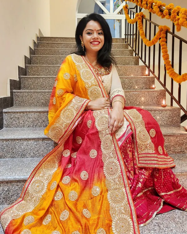 Dressed for Diwali in a stunning pink and yellow lehenga with intricate gold work. This is how you combine tradition with glamour for the festival of lights.