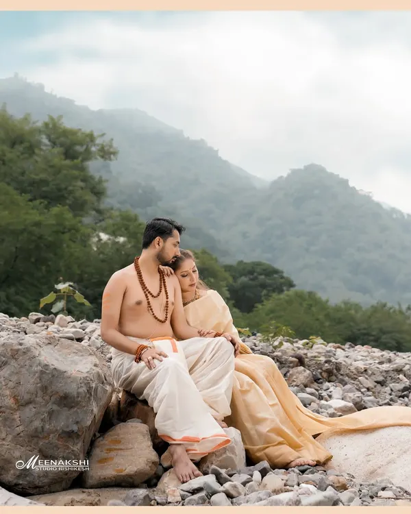 A serene pre-wedding moment for a couple on the rocky banks of the Ganga, with the misty Rishikesh hills creating a timeless backdrop. This spiritual theme is something I love to explore with couples who share a connection with the city.