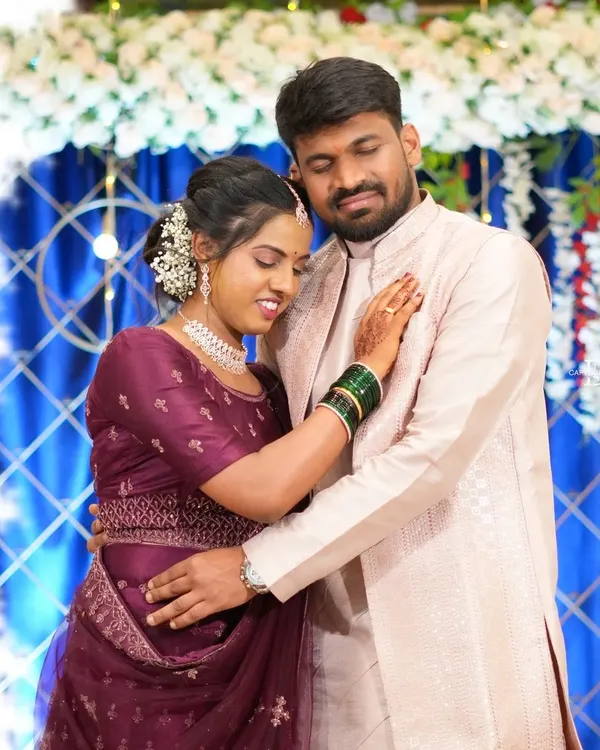 This is the kind of real, unforced moment I love to capture during an engagement or reception. It's a quiet embrace between the couple, showing their connection against the backdrop of the celebration's decor.