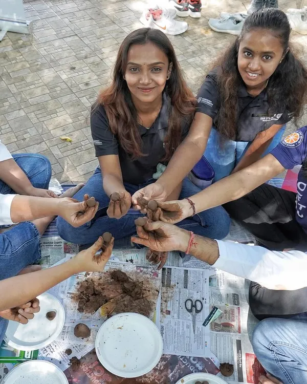 A group of students and faculty from Ramaiah University join hands to create over 100 seed balls. This hands-on activity is a wonderful way to engage in environmental stewardship and team collaboration.