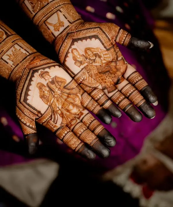 A professionally captured photo of one of my bridal portrait designs. In the course, we cover how to create this level of detail, focusing on shading and proportion to bring the figures of the bride and groom to life on the palms.