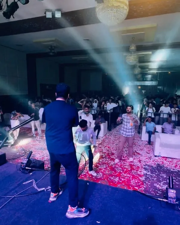 On stage at a college fest, with the confetti cannon going off. The energy from the students is absolutely electric.