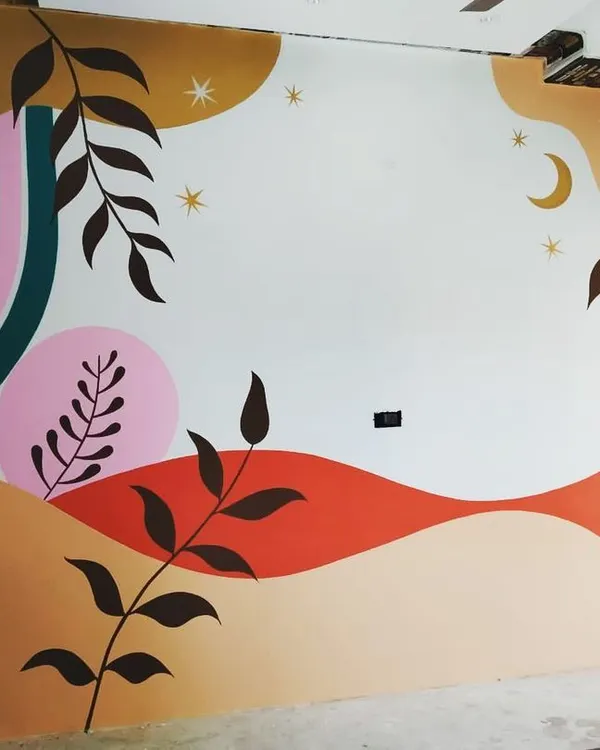 A vibrant and modern abstract mural I painted to liven up a room. The design features flowing lines, botanical silhouettes, and a playful color scheme including pink, orange, and teal.