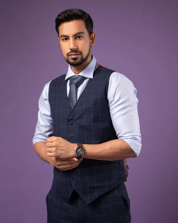 A classic corporate headshot. The pose is confident and the direct eye contact is engaging. I used a simple purple background for a modern touch.