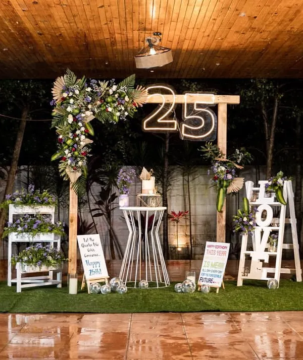 An intimate milestone celebration for a 25th birthday. I created this rustic yet chic setup by a poolside, using a wooden arch, fresh florals, and a custom neon sign to make the birthday girl feel truly special.