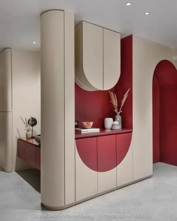 This integrated unit was my solution for a passage area, hiding a washing machine, crockery, and shoe storage behind a beautiful, wave-inspired facade. It proves utility can be a work of art.