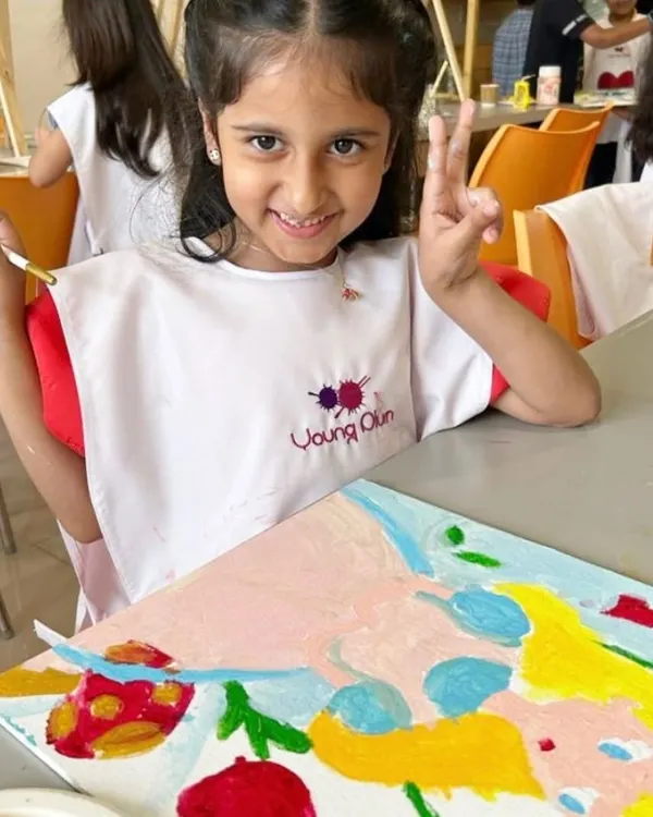 A perfect party moment! This birthday girl is all smiles during her 'Alice in Wonderland' themed art party. I customize everything, including aprons, to make the day truly special.