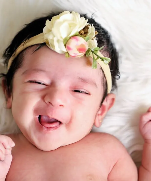That scrunchy, gummy smile is just the best. I live for these moments of pure, unfiltered joy. Capturing a baby's personality is what makes each session unique.