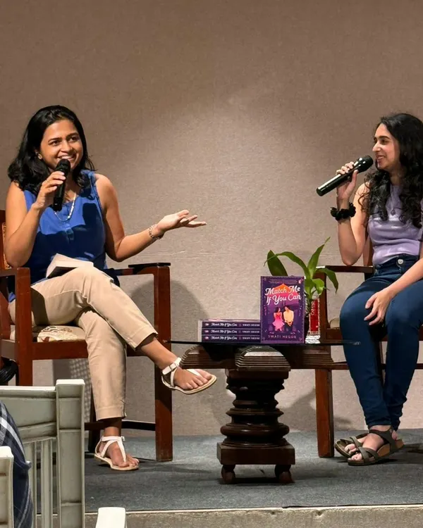 In conversation at an author event for my debut novel. I love discussing my books, the writing process, and connecting with readers in person.