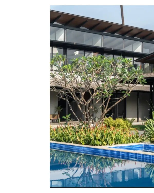 A home in Alibaug, where the pool reflects the lush greenery. Our designs for this region feature high roofs for thermal release and simple verandahs for country living.