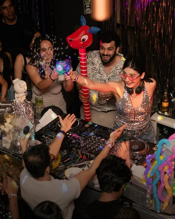 The vibes are always immaculate at Paradisco. Here I am in the middle of the crowd, sharing props and dancing with everyone. It's all about creating a fun, interactive party experience.