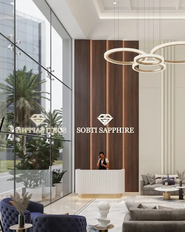 A grand, double-height reception for Sobti Sapphire, designed to make a powerful first impression. We used a modern palette of cool neutrals, rich wood paneling, and statement ring chandeliers to create a welcoming yet impressive corporate lobby that reflects the brand's prestige.