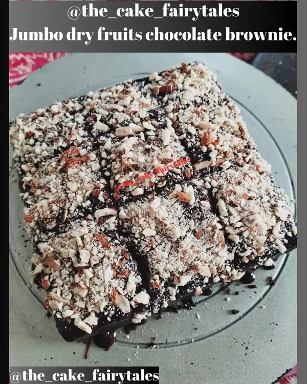 My jumbo dry fruits chocolate brownie, fresh from my kitchen. It's a rich, dense brownie topped with a thick layer of chocolate and lots of chopped nuts for a satisfying texture.