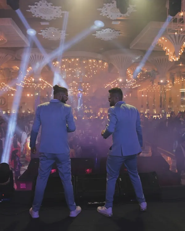 We don't just perform on stage; we command it. This is the view from our side, facing a sea of energy at a corporate gala. We bring this level of production and excitement to every event, ensuring a memorable night for your entire team.