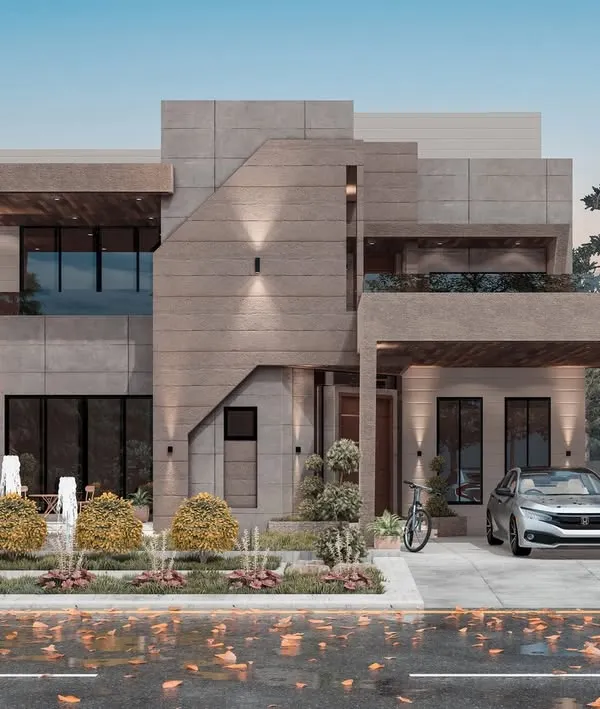A daytime view of our modern concrete villa project, highlighting the clean lines and interplay of solid and void. The design emphasizes natural light and provides a clear view of the thoughtful landscaping integrated into the property's exterior.