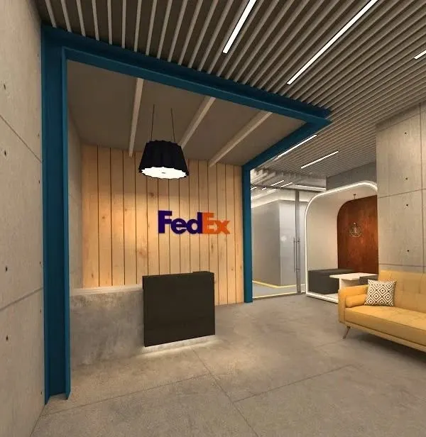 The reception area we designed for FedEx, which rethinks the conventional corporate entrance. We used a combination of raw concrete, warm wood paneling, and bold brand colors to create a modern and welcoming first impression.