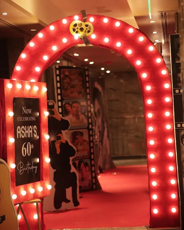 The first impression is everything. This glowing archway, designed for a retro-themed 60th birthday, set the stage for a glamorous night. I design entrances that build excitement from the very first step.