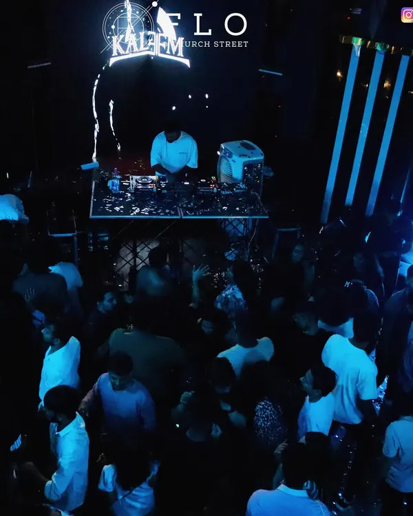 A wide shot of the packed floor at Flo Church Street. The blue lighting and energetic crowd capture the electric atmosphere of my Saturday night sets.