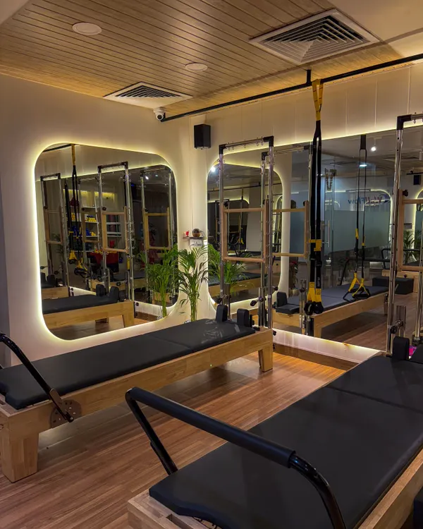A glimpse into our brand-new studio in GK 2, Delhi. The space is designed with modern aesthetics, featuring backlit mirrors and state-of-the-art equipment to inspire your best workout.