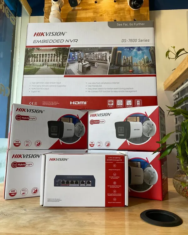 This is a standard professional security kit we provide, featuring a Hikvision NVR, 4MP IP cameras with audio recording, and a POE switch. This setup allows both power and data to be sent over a single ethernet cable, simplifying installation.