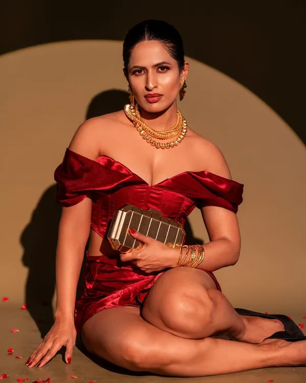 A bold and glamorous shot featuring a velvet co-ord set. The spotlight lighting technique creates a dramatic, high-fashion look, perfect for a magazine-style portrait.