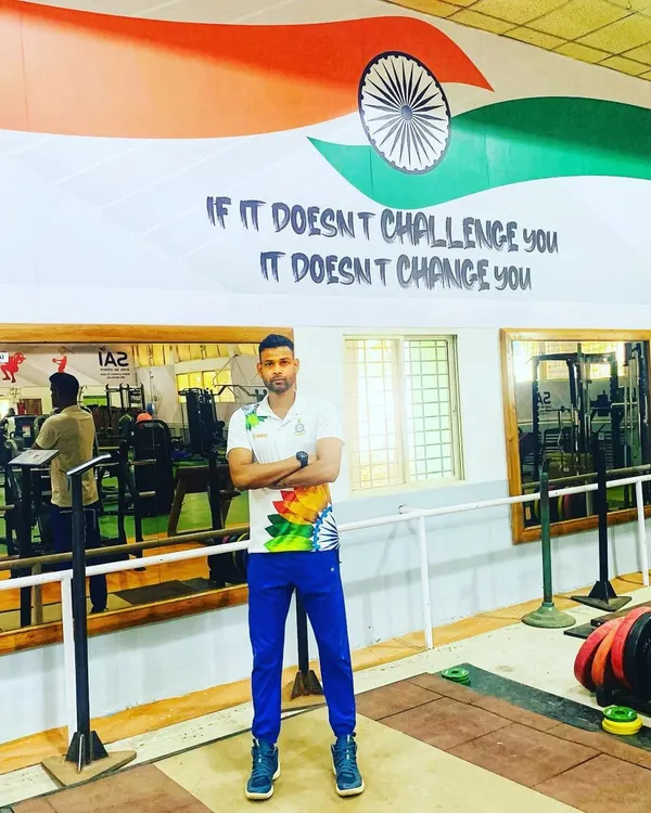 Standing in the gym at SAI Bangalore. The quote on the wall says it all: "If it doesn't challenge you, it doesn't change you." This is the philosophy we live by, both in the gym and on the court.