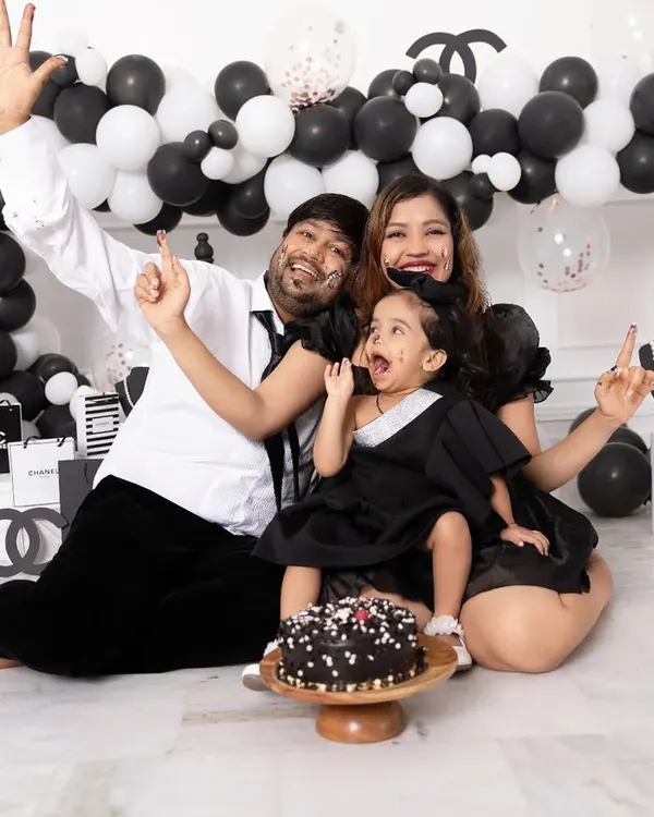 Celebrations should be full of life and personality. This family is having a blast during a Chanel themed cake smash session, complete with a custom balloon arch and designer props provided by our studio.