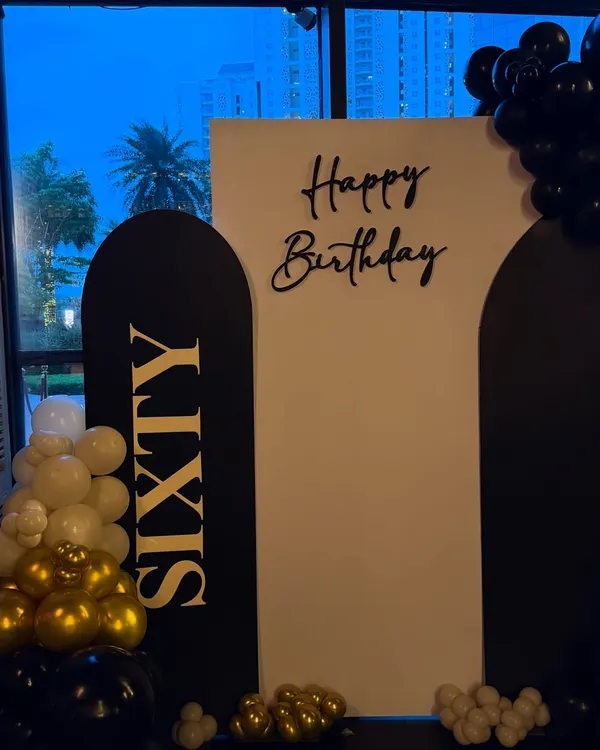 For a grand 60th birthday at Whiskey Samba in Gurgaon, we designed this sleek and modern backdrop. The black and gold color scheme with bold "SIXTY" lettering creates a timeless and celebratory photo opportunity.