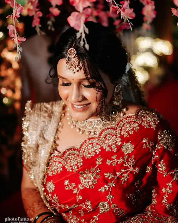 A modern bride with a traditional touch. This photo captures a candid moment of the bride enjoying a coffee break during her getting-ready session.