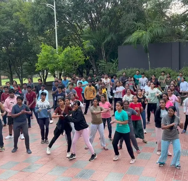 The entire group of students at Atria Institute of Technology fully engaged in an early morning dance session. This shows how I can manage and motivate very large crowds to participate together.