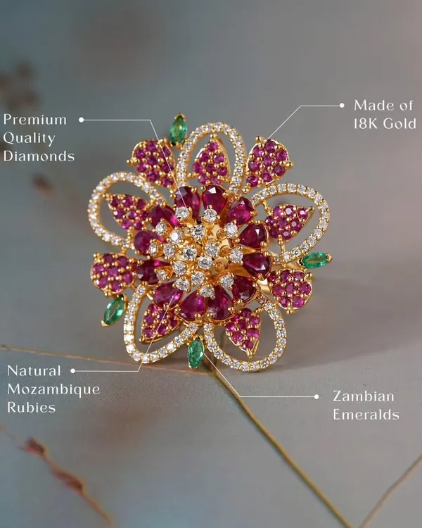 This floral ring is a testament to what I love to create. It is crafted in 18k gold and features a bloom of natural Mozambique rubies and premium quality diamonds, with delicate Zambian emeralds as leaves. This is a one-of-a-kind auction piece, representing the pinnacle of my design philosophy.