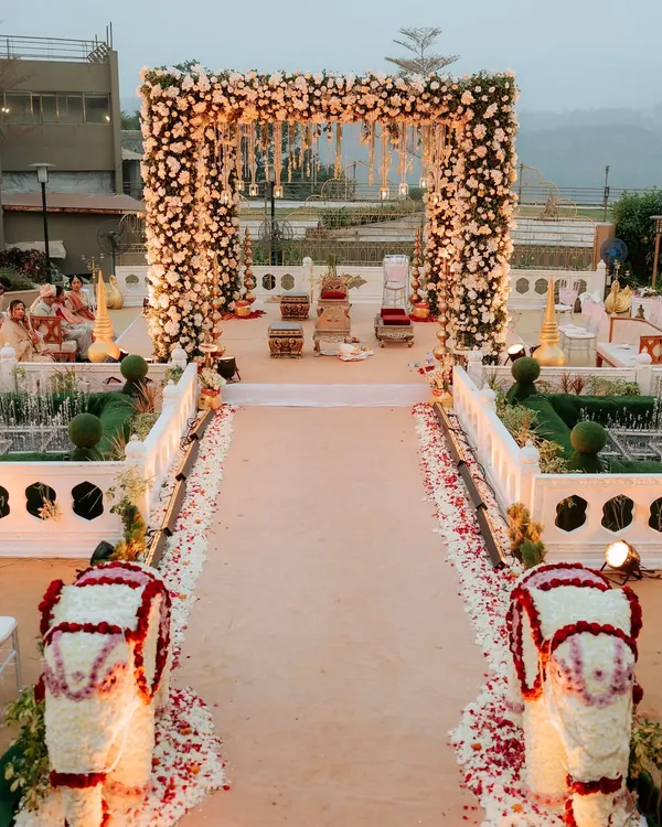 This is the kind of breathtaking entrance I love to create. For this Khandala wedding, I designed a grand floral archway and aisle, lined with custom elephant statues made of flowers, to give the couple a truly royal welcome to their ceremony.