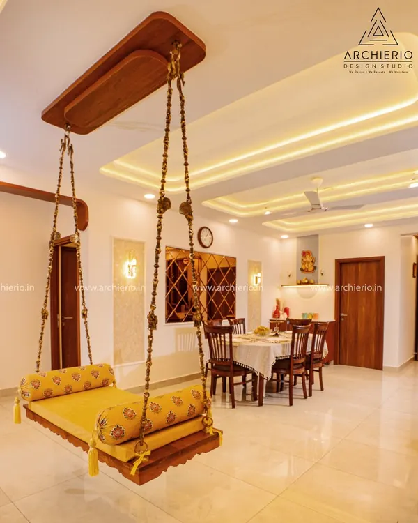 This traditional Indian swing, or *oonjal*, is more than just furniture; it's a piece of nostalgia and comfort, elegantly woven into a modern living space to create a soulful home.