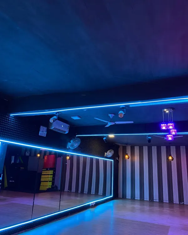 A glimpse of our main dance hall. We've designed the studio with professional-grade floors, full-length mirrors, and dynamic lighting to create an inspiring and safe space for our students to learn and grow.