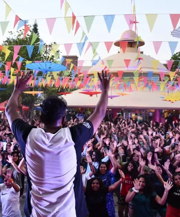 Our trainer leading a massive crowd in a dance fitness session at a Wonderla event. We love bringing the energy and joy of movement to large audiences.