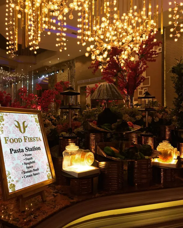 My live pasta station is a journey to Italy. Guests can choose their favorite pasta, from penne to fusilli, and watch as my chefs toss it in a sauce of their choice, be it a classic tomato basil or a rich cream sauce.