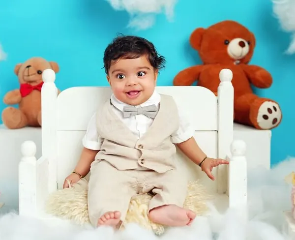 This little gentleman is sitting up like a pro. Milestone sessions are perfect for capturing these big achievements, and this "teddy bear picnic" theme adds a touch of whimsy.