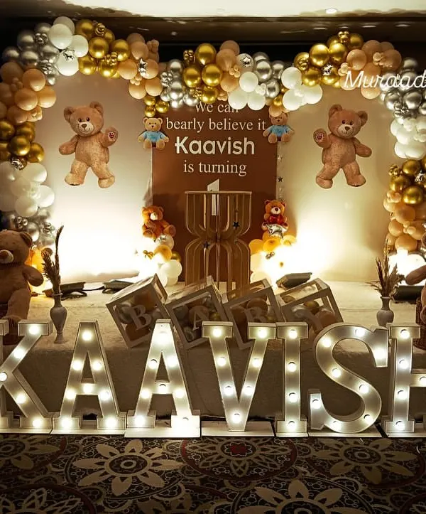 We can 'bearly' believe he's one. This adorable teddy bear themed first birthday features a full stage setup with marquee letters for the name, a custom backdrop, and lots of cute teddy bears.