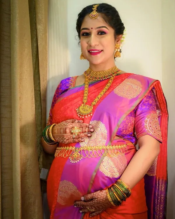 Another gorgeous mom-to-be. For her baby shower, I used bright and happy colors, with a pop of pink on the lips and shimmery eyeshadow to match her vibrant saree.